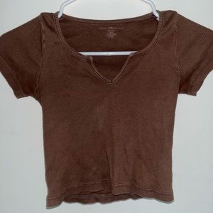 brown baby tee with a tiny slit down the middle:)